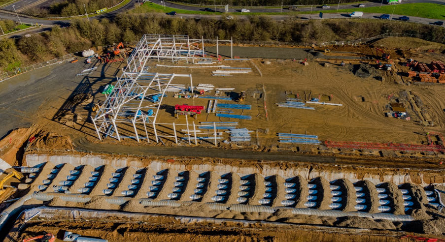 Drone photographs of Stane Retail Park under construction showing the steelwork for B&Q